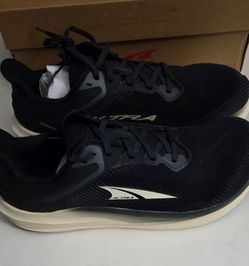 New in box of an Altra Men's Torin 8 running shoe in the Black/White colorway (size US 10.5, UK 9.5, EU 44.5).