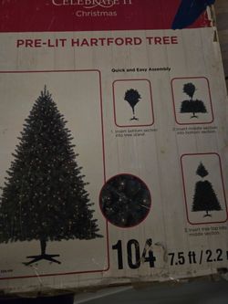7.5 ft Pre-Lit Hartford Artificial Christmas Tree (Celebrate It) and a Winter Wonderland 6-Piece Pre-Lit Holiday Décor Set.
