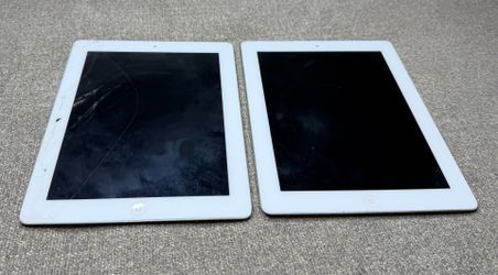 Lot of two Apple iPads. Sold as-is. Untested.
