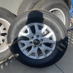 Less than 100 miles Toyota wheel and tires