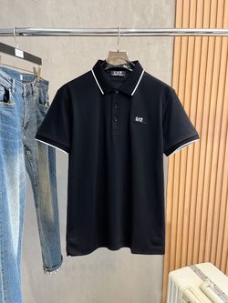 Black EA7 Emporio Armani short sleeve polo shirt with a three  button placket.