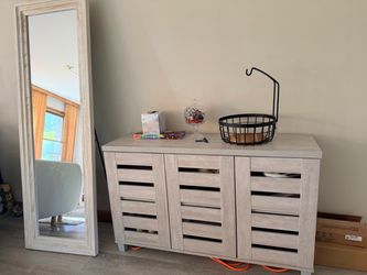Shoe cabinet and a mirror
