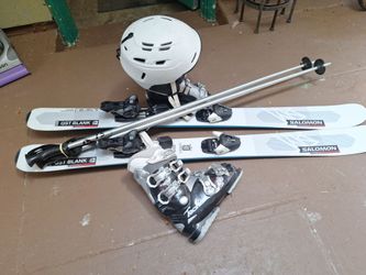 Like New salomon128cm skis  technica boots 23.5  helmet and poles