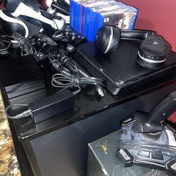 PS4 Gamer’s Bundle: Console, VR Headset, VR Gun, Camera, Wheel, Controllers, Games