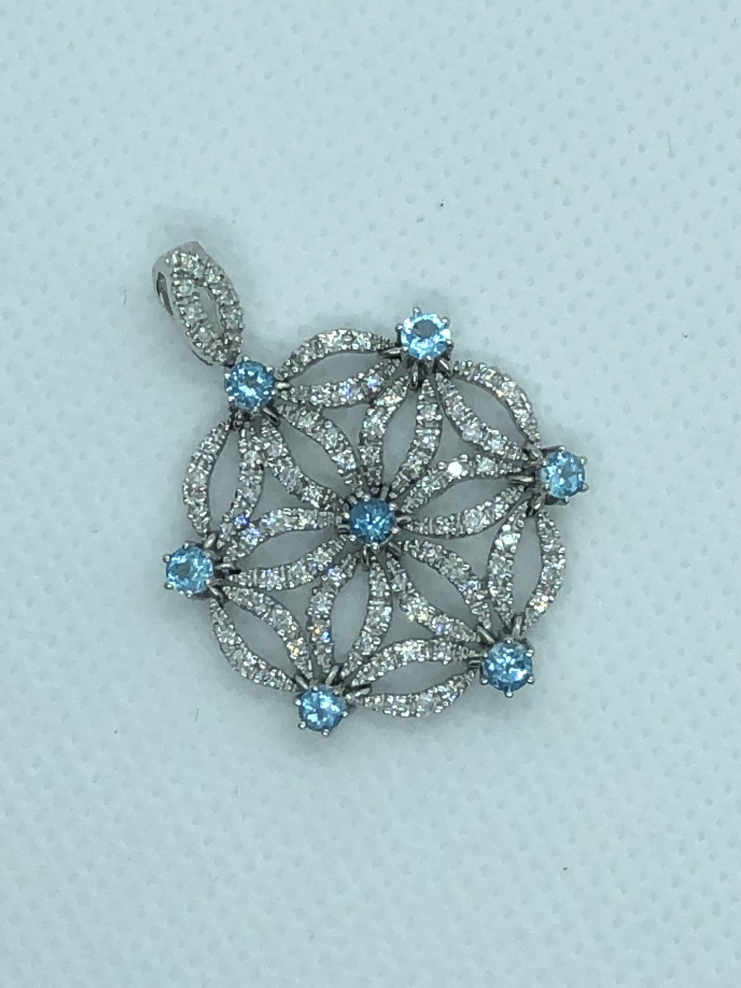14k white gold, diamond, blue topaz pendant