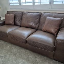 NATUZZI Leather Sofa.