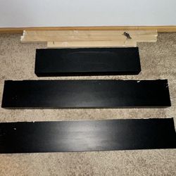 Floating wood wall shelfs with mounts "currently laminated over the wood not painted"