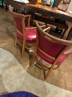 2 red leather western style chairs nice good condition they’re comfortable