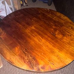 Solid Wood Round Table Very Heavy This is a round table 40" Diameter 19" High, metal legs, it's very heavy