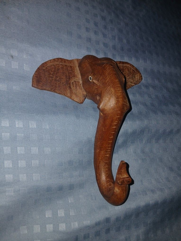 Vintage Handcrafted Wooden Elephant Hooks. Great for hanging keys on or as a towel holder or jewelry holder. 5 1/2 inches tall and 4 1/2 inches wide.