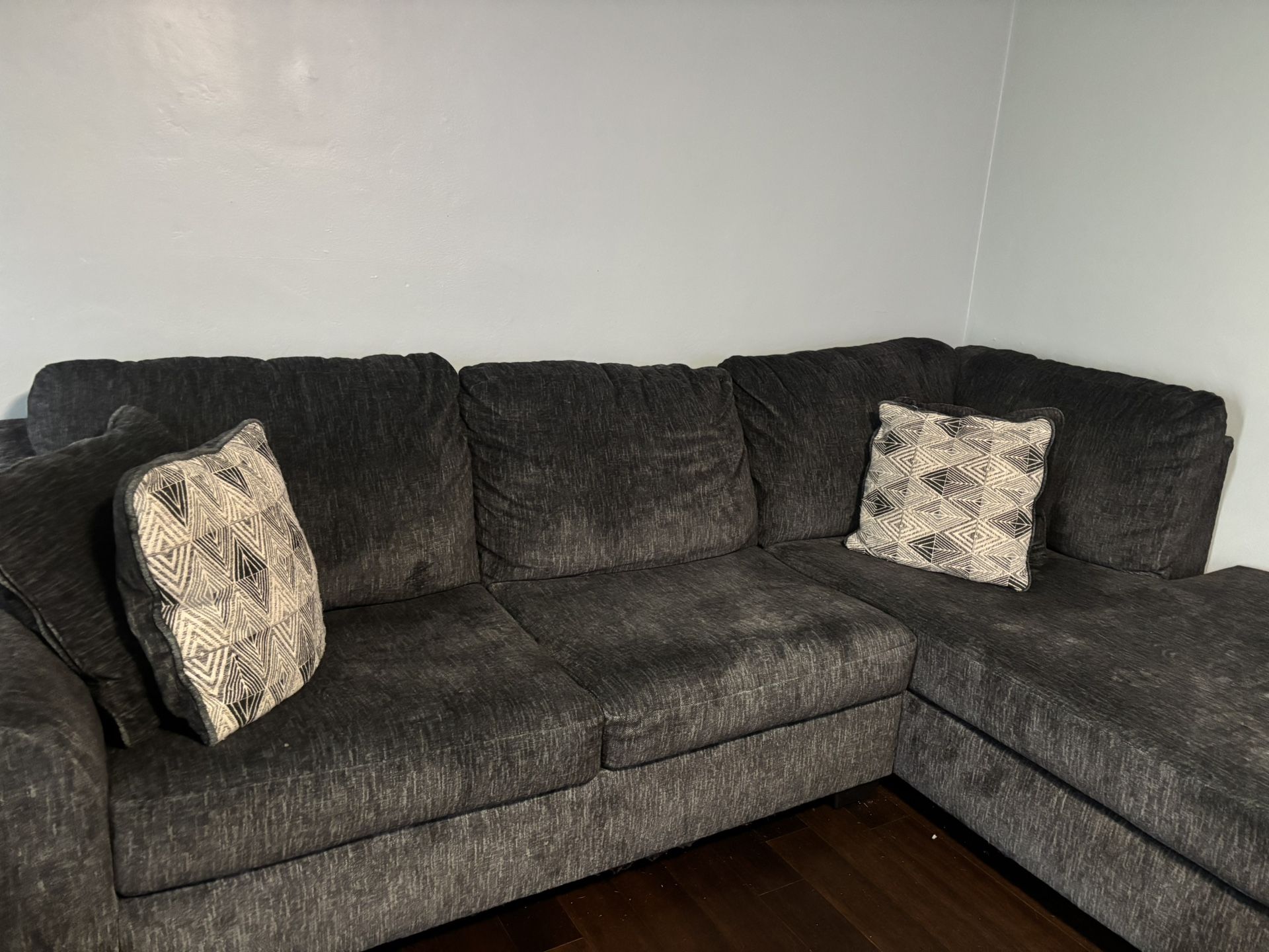 Grey Couch with Megginson Swivel Chair