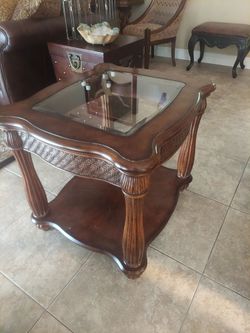 End table. Solid wood,insert glass  top.
