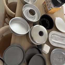 Lots of cookware! Cake pans, crockpot, decorative platters, bowls, vases