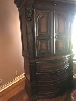 Nice wooden armor by Ashley furniture great condition