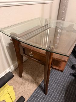 Set of two brown glass top end tables