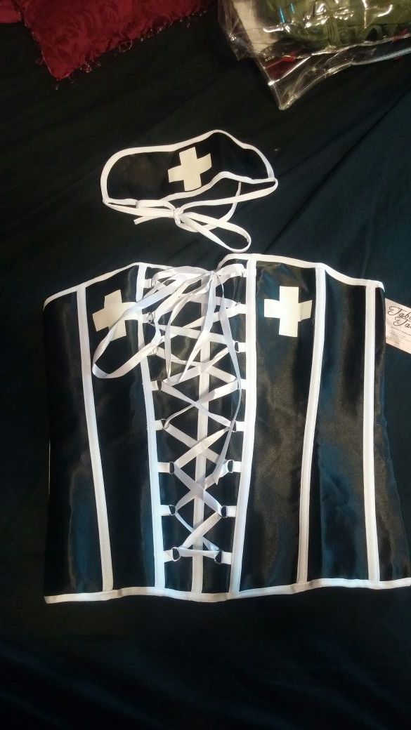 Black/white nurse corset and headpiece. Brand new never worn. Size XL fits like M/L. Bought from Taboo Taboo.