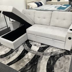 SECTIONAL SLEEPER FEATURING ARM STORAGE AND USB PORT 