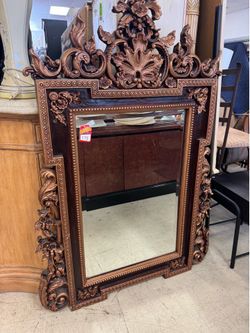 ornate Spanish carved walnut mirror features a prominent decorative swan or goose at the top - 37” x 60”