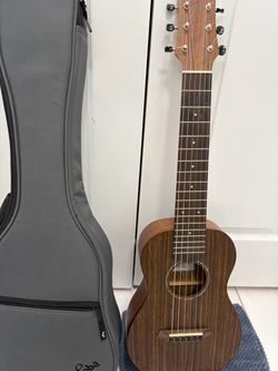 Classic guitar Cordoba Mini-O Nylon strings , with case .