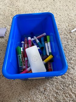 Dry erase board markers, eraser and bin