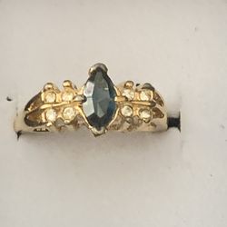 Beautiful Gold Ring w/ A Very Dark Blue Sapphire & Clear Stones