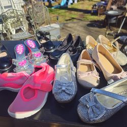 The price is firm.. 8 pairs of little girls shoes