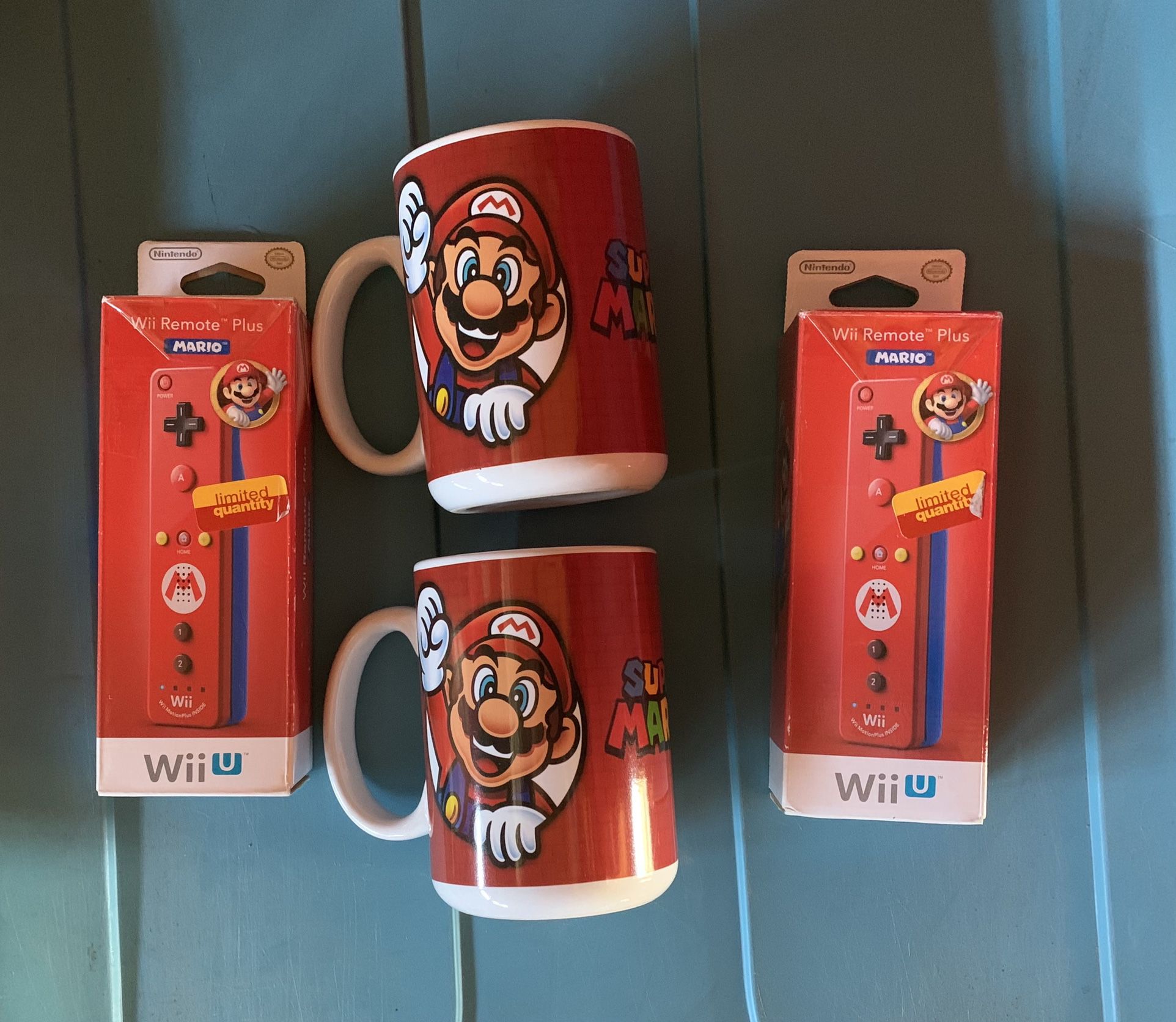 Official Pair of Nintendo Mario Wii U Remote Plus  and two Super Mario Coffee mug .  New 