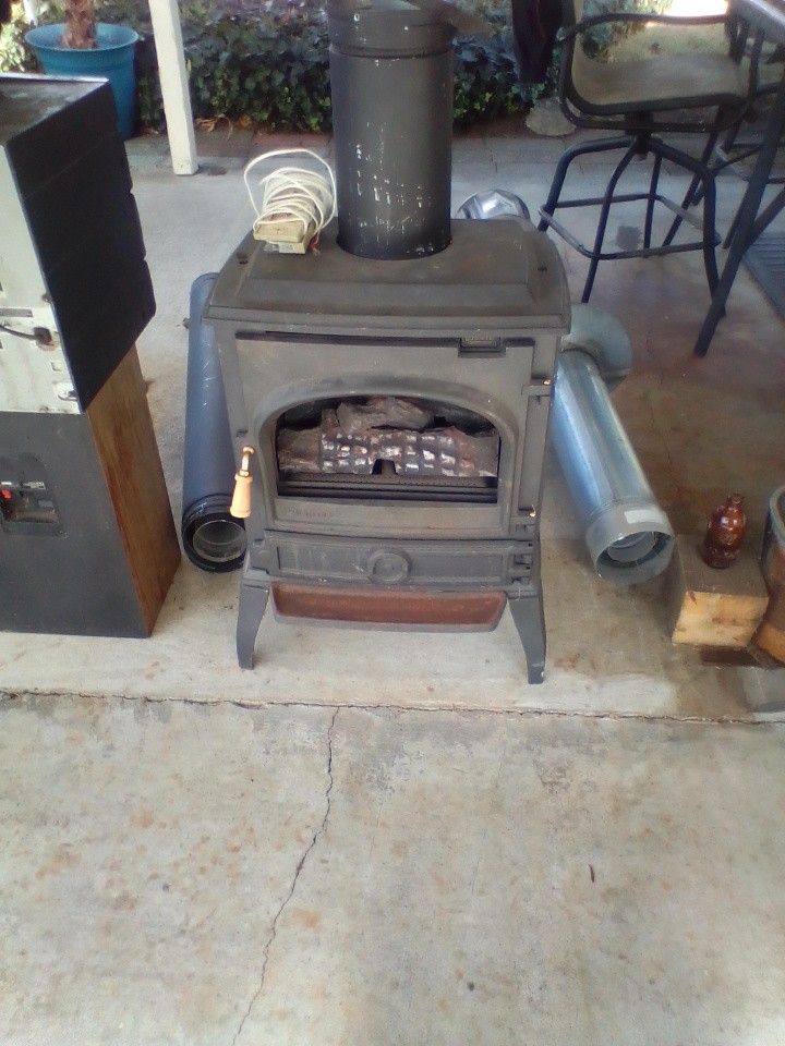 One Gas Stove And Pipe Made By. Dovre , Model. DV400