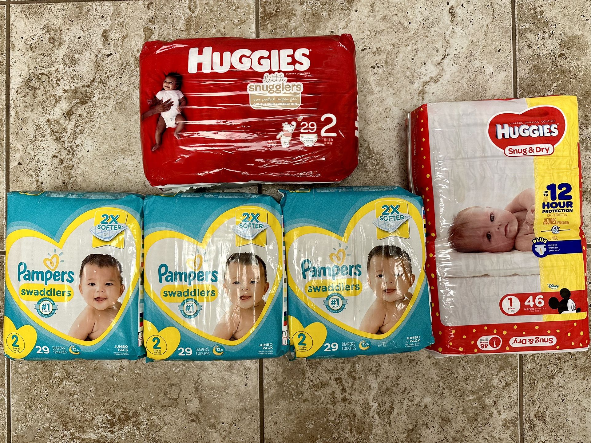 Size 1 and 2 Pampers and Huggies Diapers