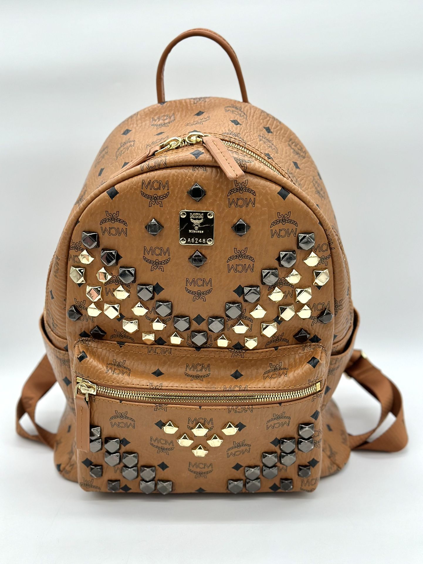 MCM Stark Side Studs Medium Backpack in Cognac Visetos