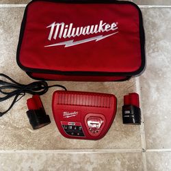 2    BATTERIES .   Milwaukee M12 12-Volt Lithium-Ion Starter Kit with Two 1.5Ah Battery Packs and Charger
