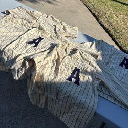 (4) VINTAGE ORIGINAL WOOL BASEBALL JERSEYS THEY WAS PURCHASED AT AN AUCTION I AM NOT SURE WHO WORE WHAT