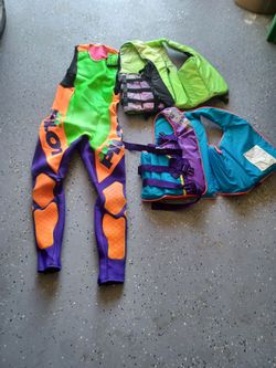 2 adult size, large life vests, with adult jet pilot wetsuit Sz L. all for $30 firm.