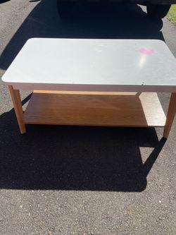White and wood coffee table with storage shelf