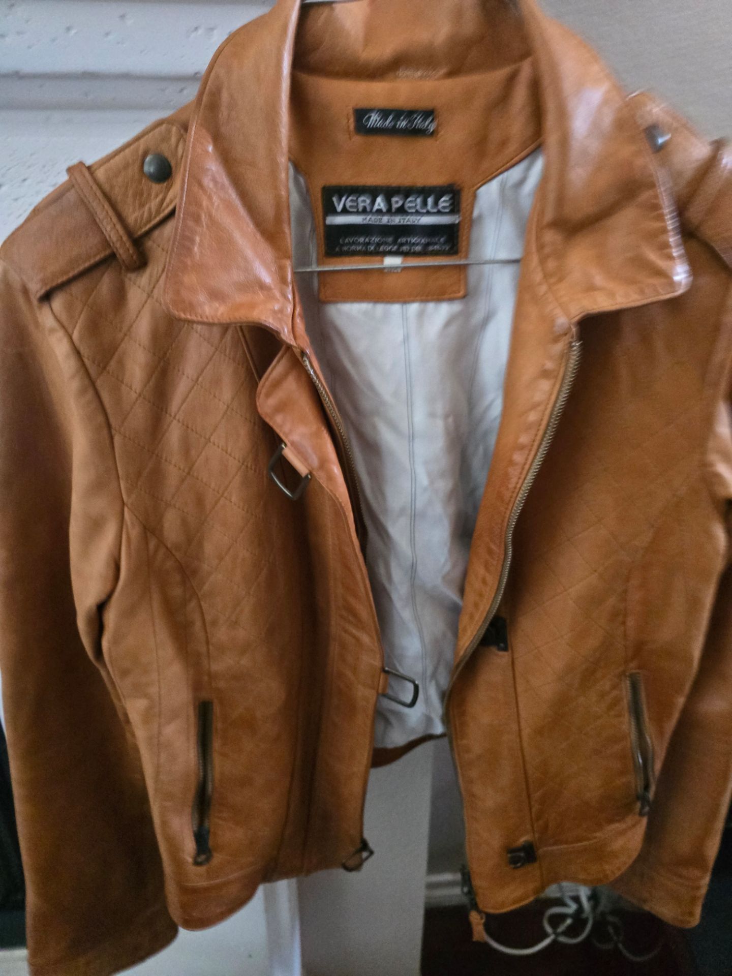 Vera Pelle tan leather jacket with a classic zip-front design. Crafted from genuine leather for durable, comfortable wear. Clean, versatile tan color