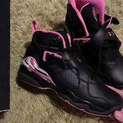 pink and black jordan’s 