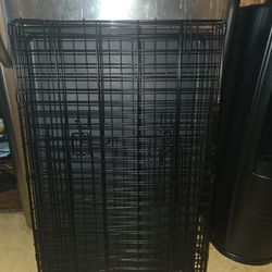 Dog cage with a divider