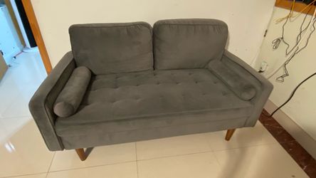 gray suede loveseat couch with pillows