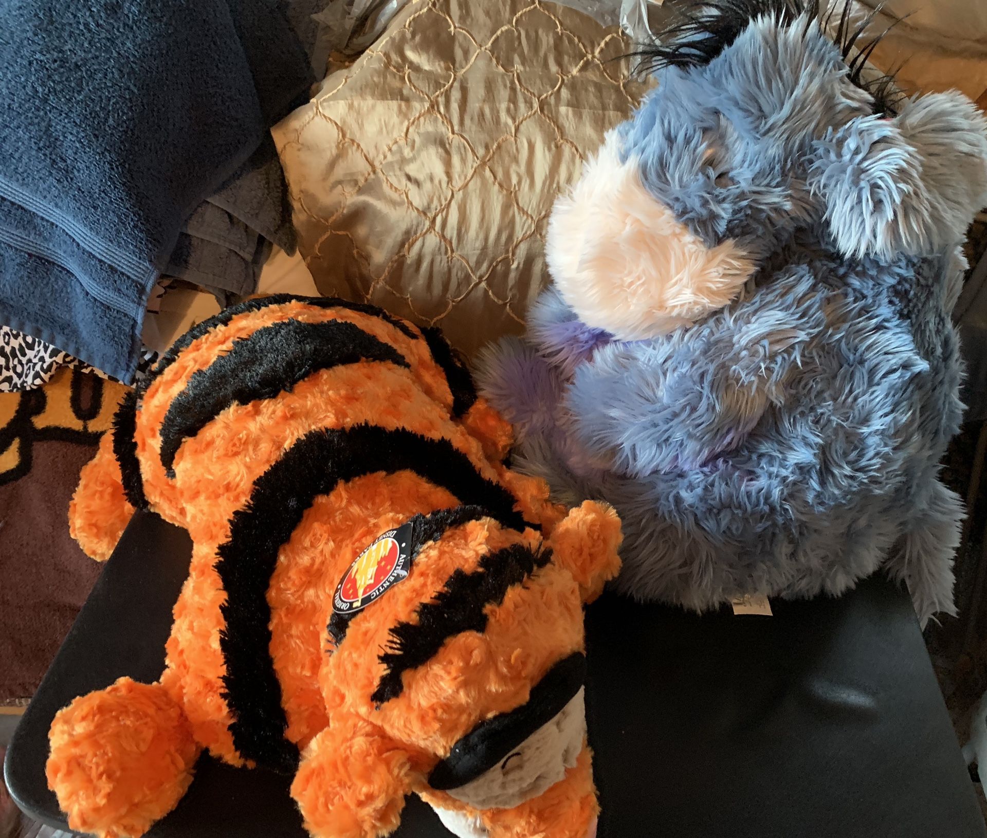 Tiger plush pillow and Eeyore plush