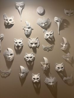24 decorative white masks.