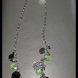 Silver and green necklace with textured discs