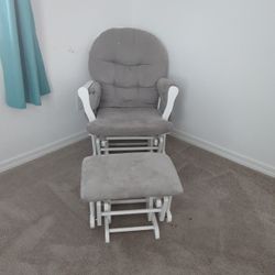  Storkcraft Hoop Glider and Ottoman set with a white wood frame and gray cushions. 