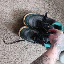 black and turquoise jordans size seven y 