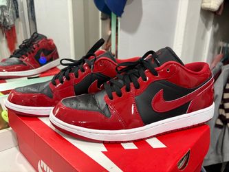 Air Jordan 1 Low in a red, black, and white colorway