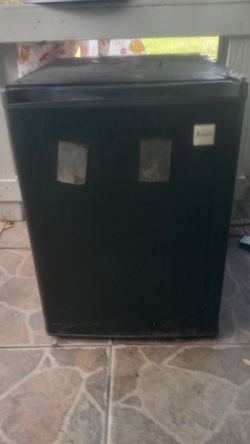 Small black mini fridge Awanti brand. 18 in long, 17 in wide and 23 1/2 in tall