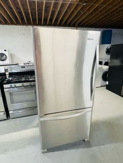Whirlpool stainless steel refrigerator (33" x 69" x 27") with a 90-day warranty on the receipt.
