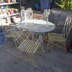 Table With 4 Chairs All Heavy duty Metal With Umbrella Opening In Midle Of Table