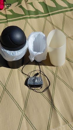 3 garbage cans and alarm clock