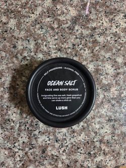 LUSH Ocean Salt Face and Body Scrub - 2.4 Oz Black Jar
