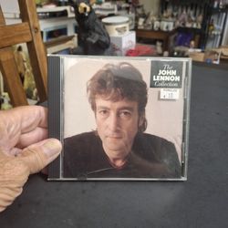The John Lennon Collection On CD, A Major Posthumous Compilation Of John Lennon's Solo Work - CD Reissued 1989 - It Includes The Insert 